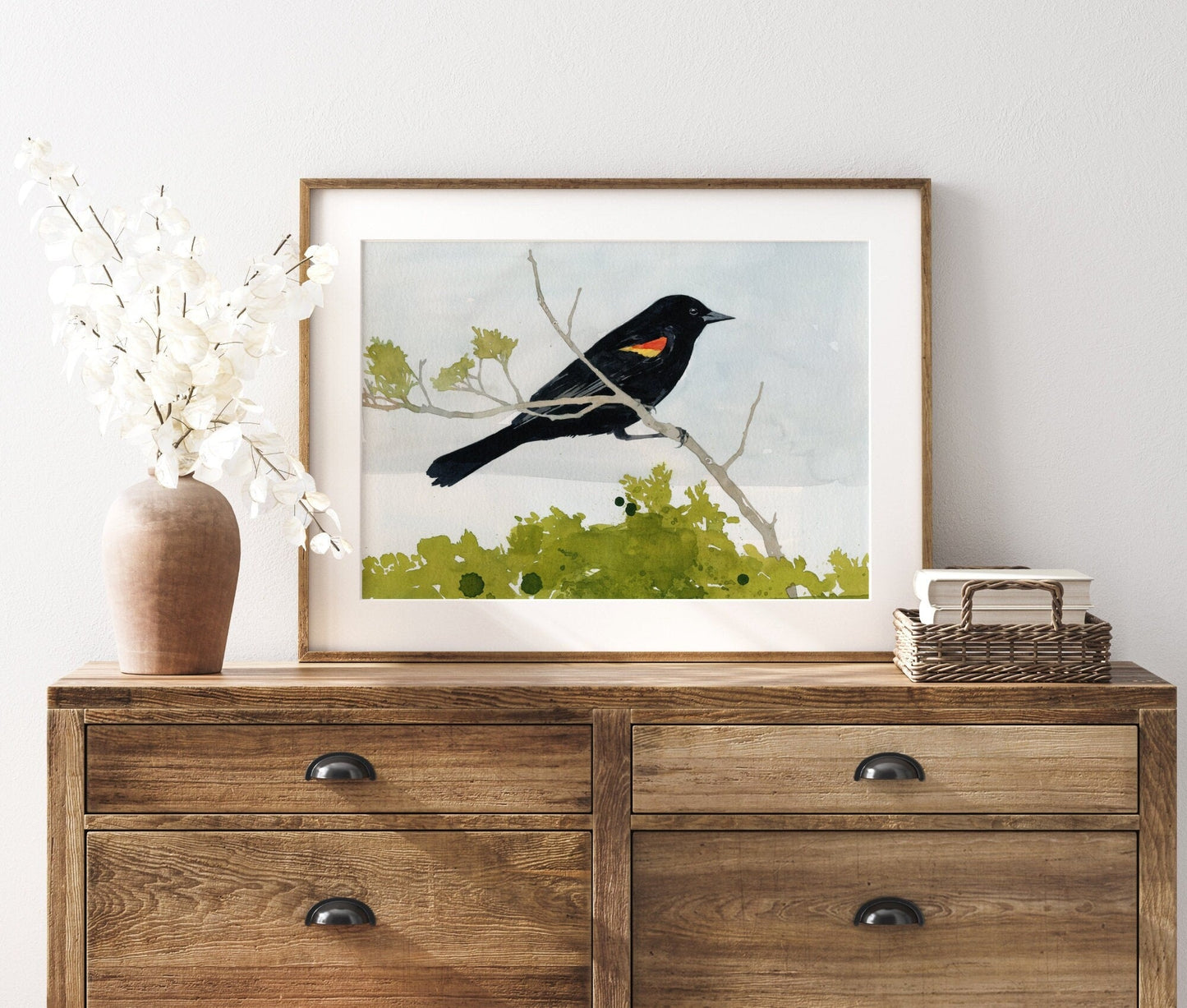 Watercolor print of a red-winged blackbird with scarlet shoulder patch, matted to 11 by 14 inches