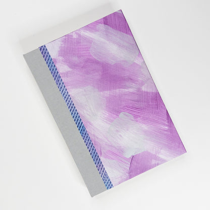 Pink, purple and silver paste paper cover with grey book cloth spine, hand bound by Patti Paulus