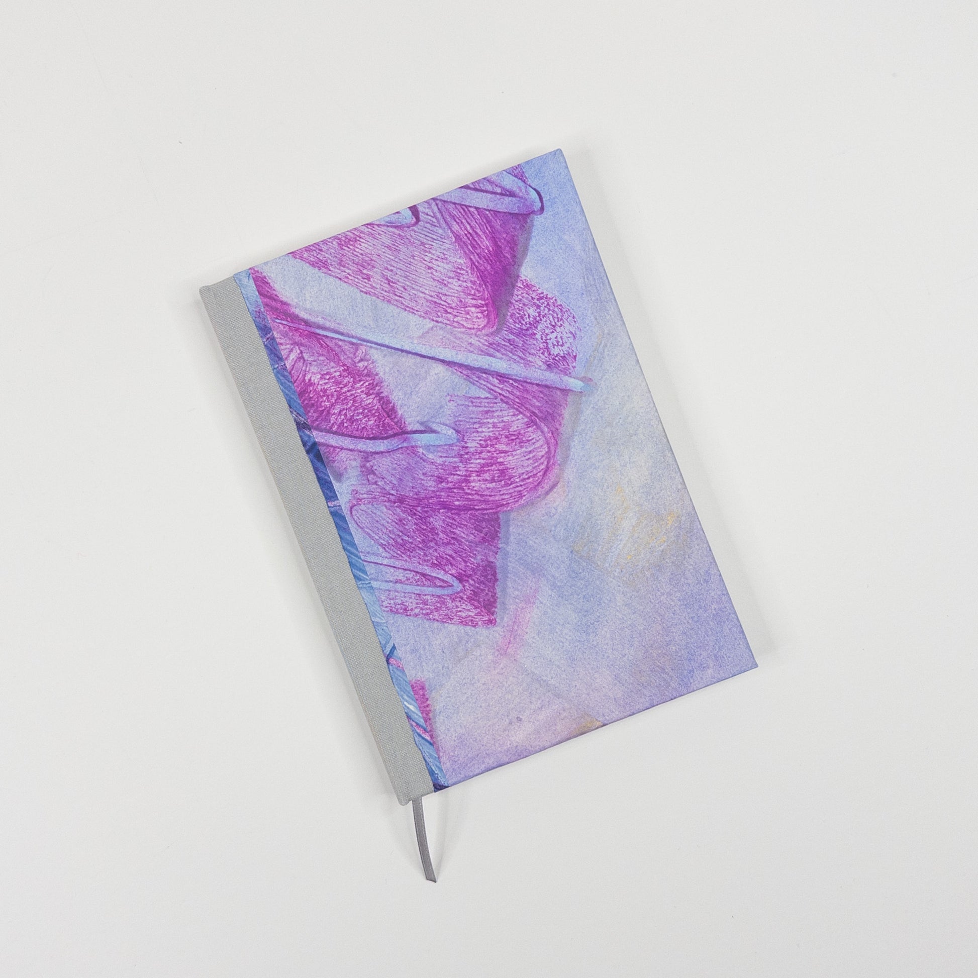 Lavender and magenta paste paper cover with pale grey book cloth spine and grey ribbon marker, hand bound by Patti Paulus