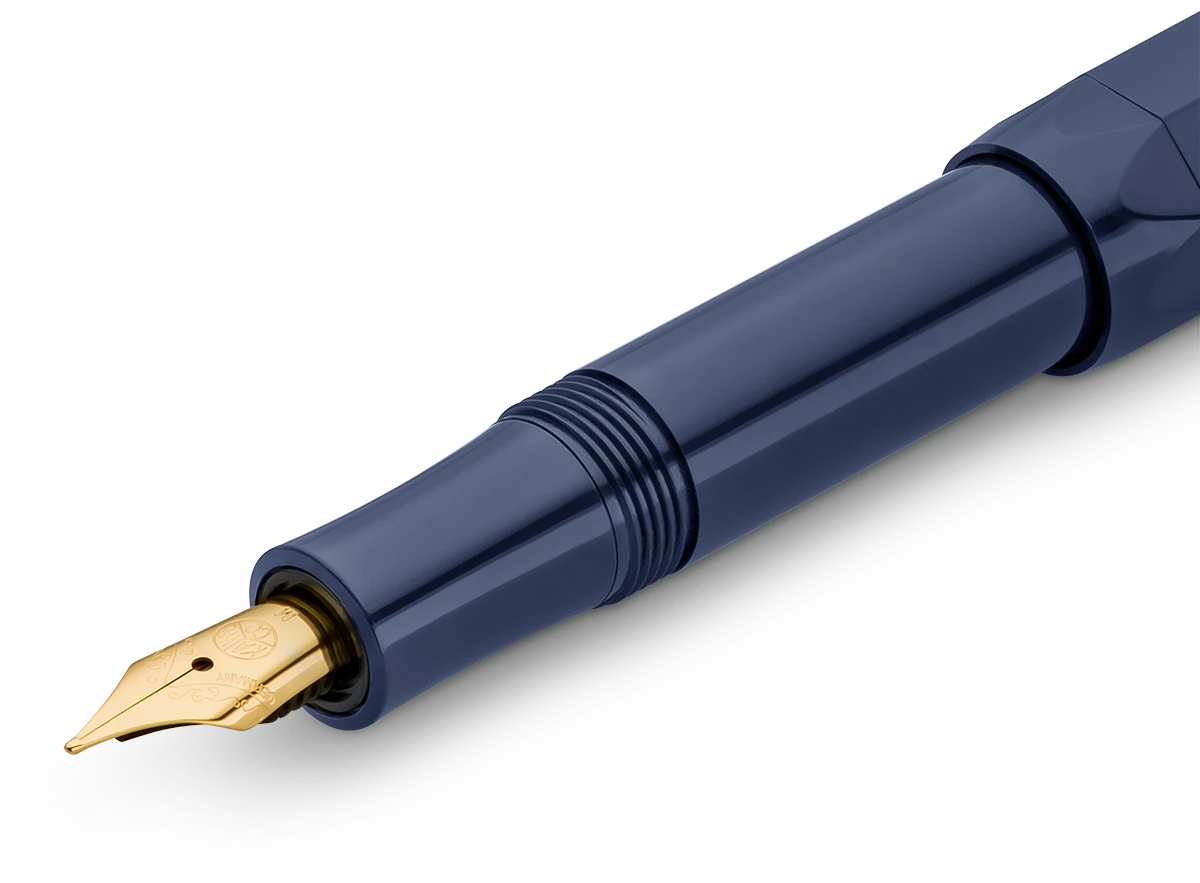 Close-up of the gold-trimmed nib on the Kaweco Classic Sport fountain pen in navy