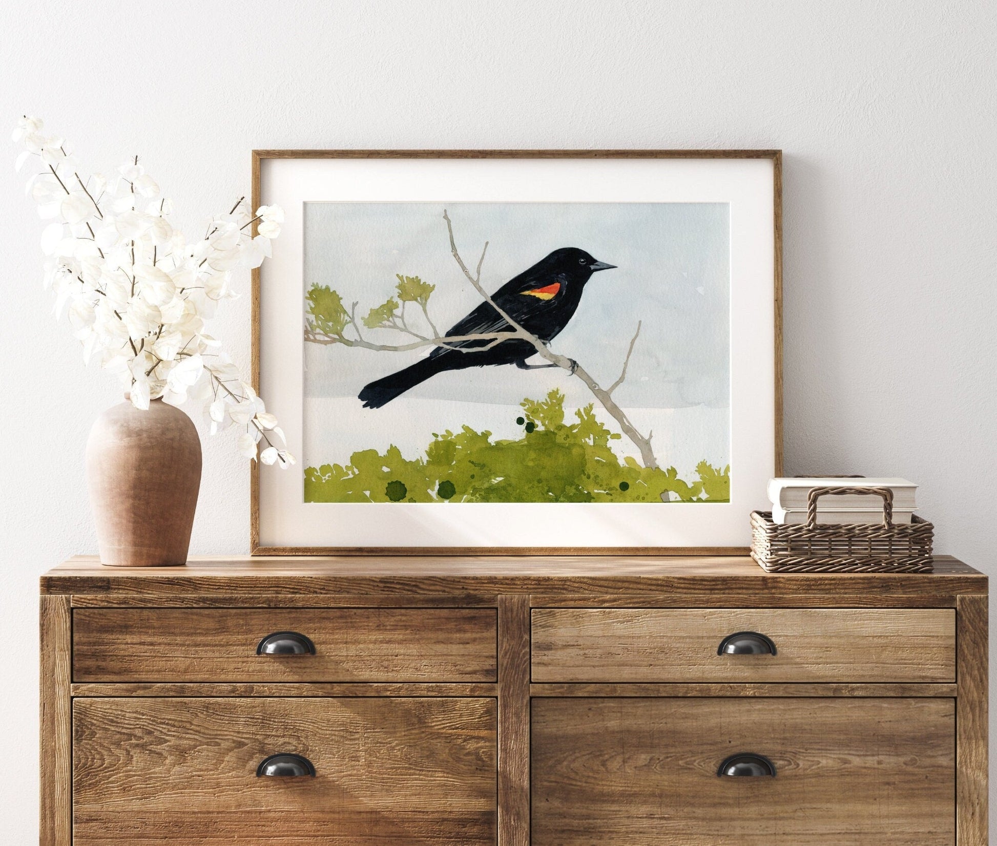 Watercolor print of a red-winged blackbird with scarlet shoulder patch, matted to 11 by 14 inches