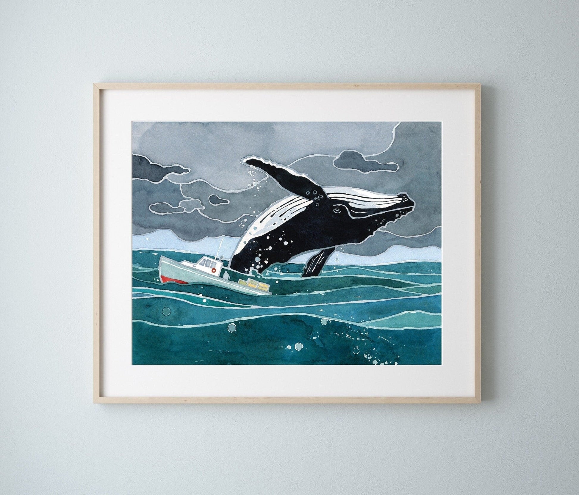 Watercolor print of a humpback whale breaching beside a small lobster boat under a stormy sky, matted to 11 by 14 inches
